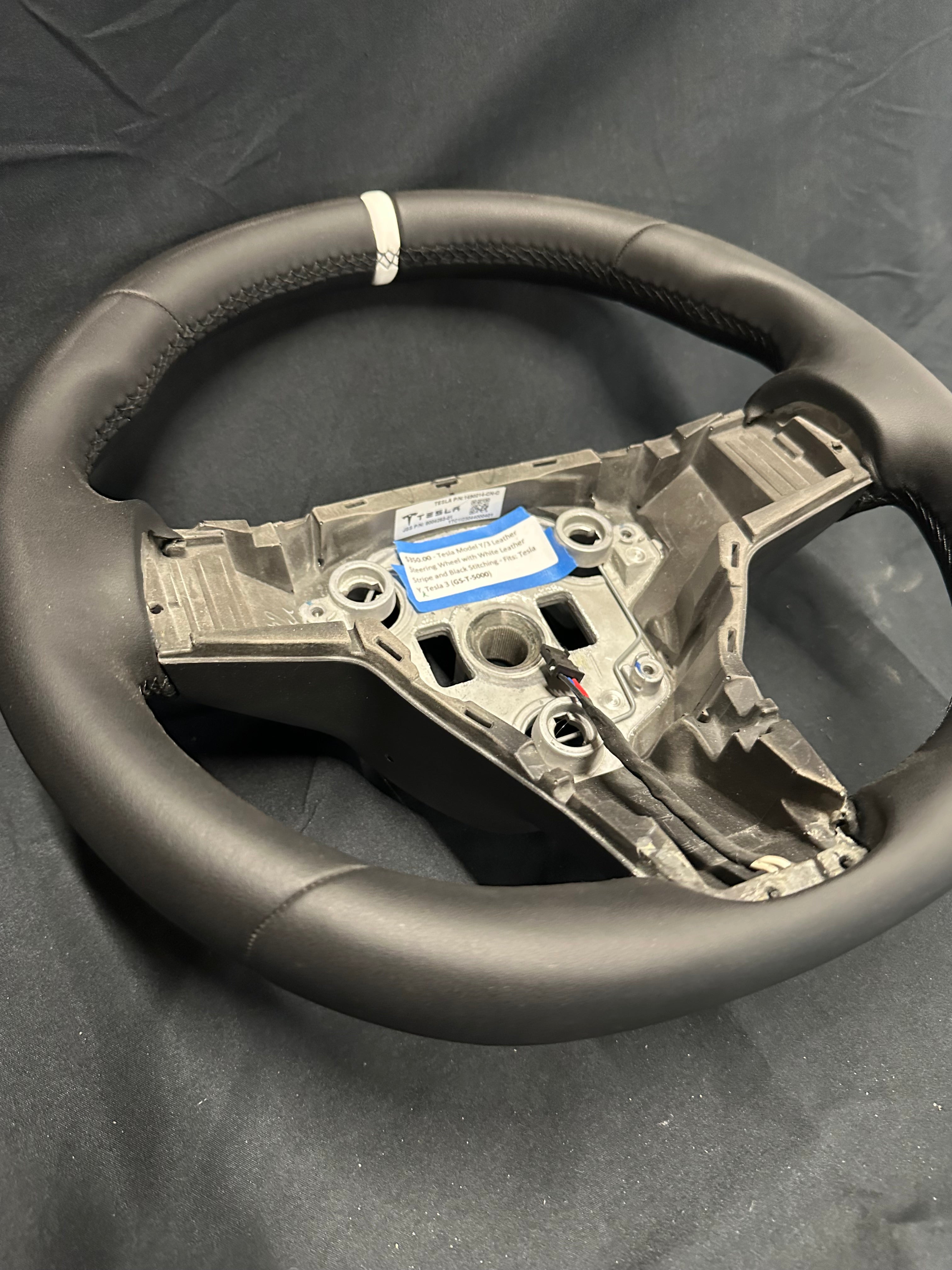 Tesla Model Y/3 Leather Steering Wheel with White Leather stripe and Black stitching.